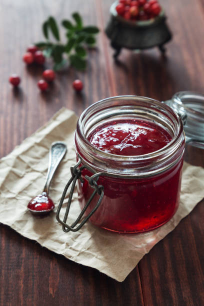 istock jar of cranberry jam with a spoon and berries 1048311734