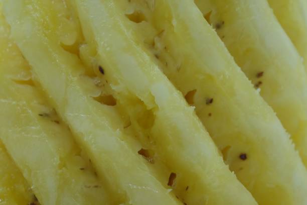 istock closeup pineapple background, yellow fruit 1048311860