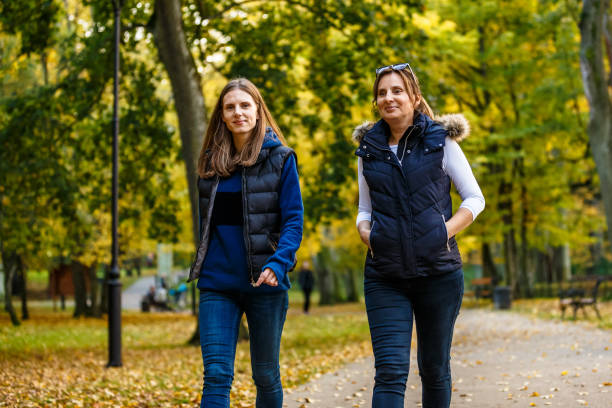 istock People walking in city park 1048313390