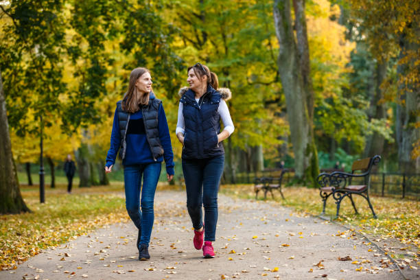 istock People walking in city park 1048315542