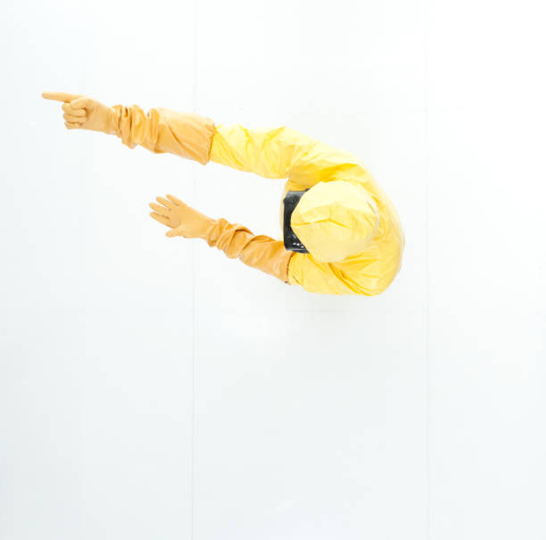 directly above view of man in protective suit pointing - 5934 imagens e fotografias de stock