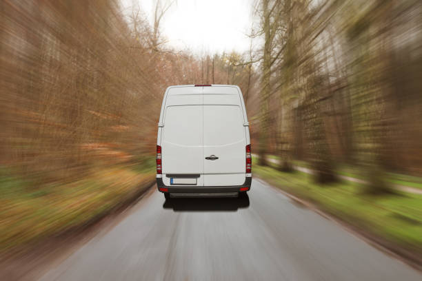 istock Delivery van on a country road 1048317032