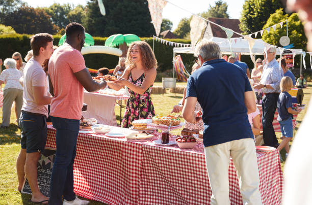 Busy Cake Stall At Summer Garden Fete Busy Cake Stall At Summer Garden Fete fete stock pictures, royalty-free photos & images