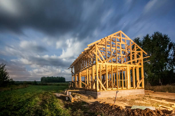 istock the construction of a village house surrounded 1048321922
