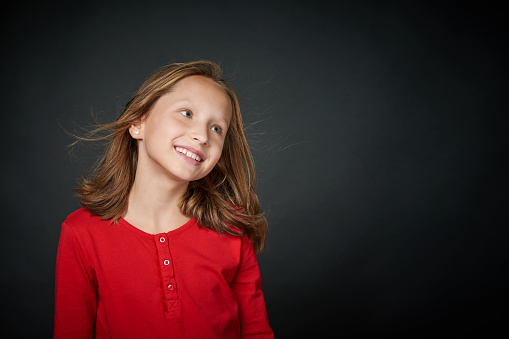 Happy Girl With Hair Flying On Wind Looking To Side At Blank Copy Space Stock Photo - Download Image Now - iStock Happy Girl With Hair Flying On Wind Looking To Side At Blank Copy Space Stock Photo - Download Image Now - iStock