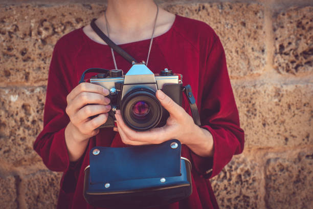 istock Teenage girl with camera 1048335644