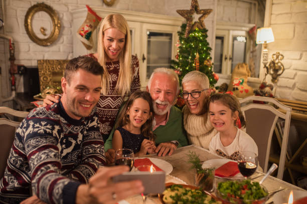 istock Young man taking a selfie with family 1048335876
