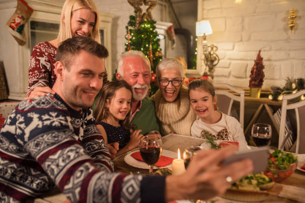 istock Family making selfie at Christmas dinner 1048335914