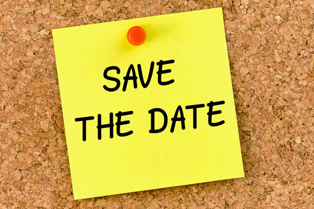 istock Save the date PostIt Note Pinned To Cork Board or corkboard 1048336202