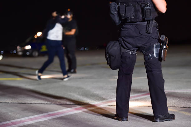 istock Night scene with special forces showing their skills in a simulated hostage rescue drill 1048336438