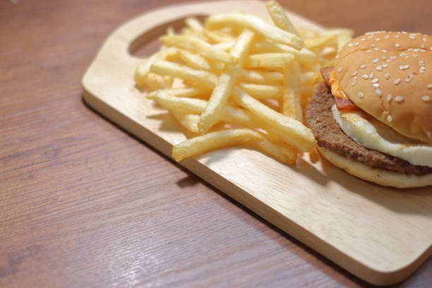 istock Bacon and egg hamburgers and fried potatoes 1048336672