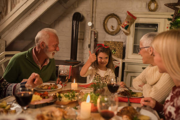 istock Girl having dinner with family 1048336912