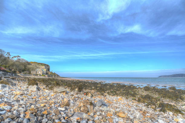 istock Red wharf bay, blue skies 1048344472
