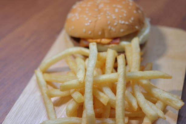 istock Bacon and egg hamburgers and fried potatoes 1048348494