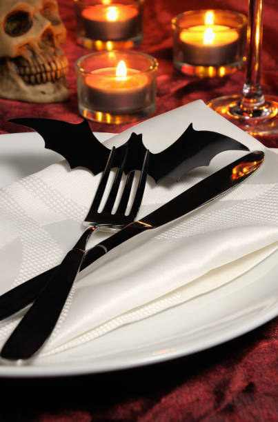 istock Knife and fork decorated with a bat on a napkin on Halloween as an element of the table servi 1048349842