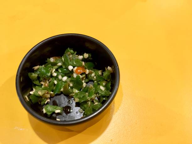 istock Remaining Chilli is finely chopped in black bowl 1048358624