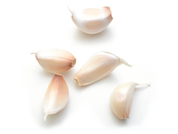 istock garlic cloves photography studio white background 1048361282