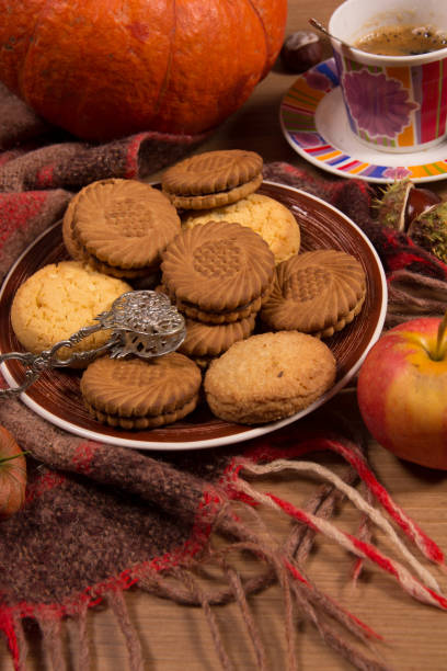 istock Autumn concept with pumpkin and a cup of coffee 1048361992