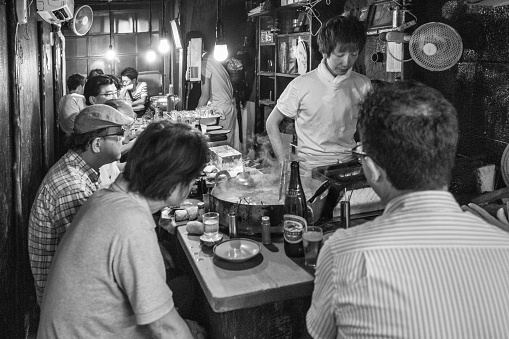 Diners eat and drink at Omoide Yokocho in Tokyo, Japan. Omoide Yokocho is famously known as \