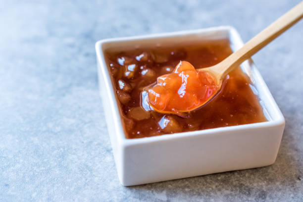 istock Homemade Quince Jam in Square Ceramic Bowl / Marmalade. 1048365866