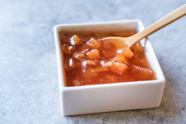 istock Homemade Quince Jam in Square Ceramic Bowl / Marmalade. 1048365970