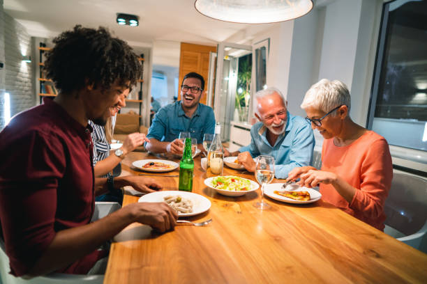 istock Family gathering at the dinner table 1048376194