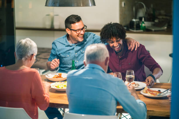 istock Family gathering at the dinner table 1048376260