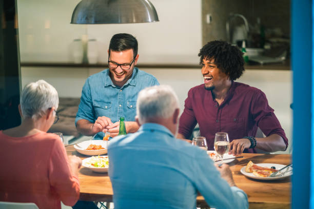 istock Family gathering at the dinner table 1048376262