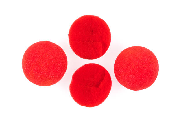 istock Red Nose Day, red nose on white background 1048383392