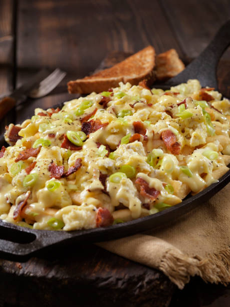 istock Breakfast Poutine with Hollandaise Sauce, Scrambled Eggs, Bacon and Cheese Curds 1048387106