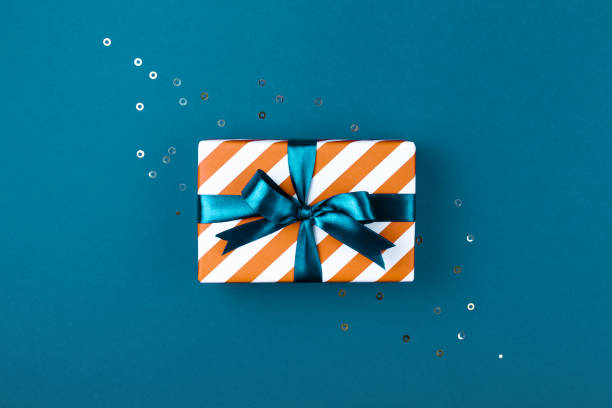 istock Gift box with aqua blue ribbon. 1048394166
