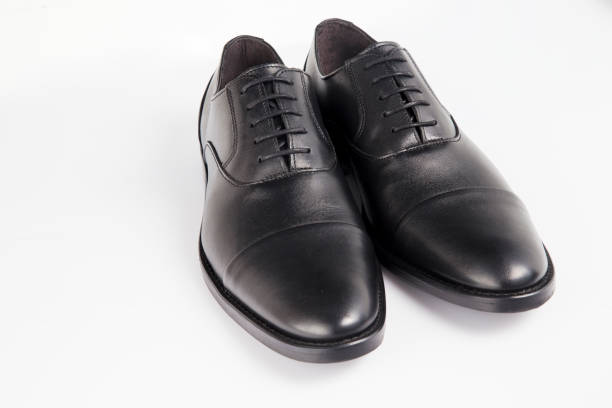 istock Male black leather shoe on white background, isolated product. 1048397600