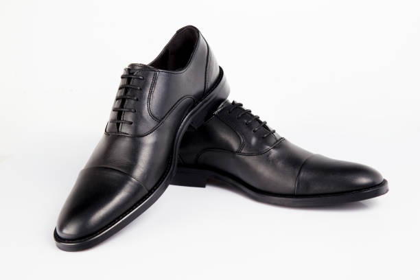 istock Male black leather shoe on white background, isolated product. 1048397632