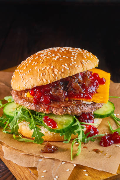 istock Homemade beef burger with cranberry sauce and arugula 1048398814