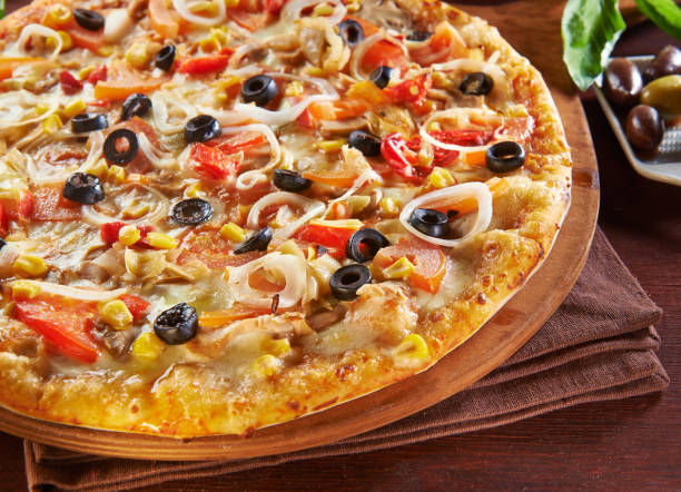 istock italian pizza on wooden table with ingredients 1048400930