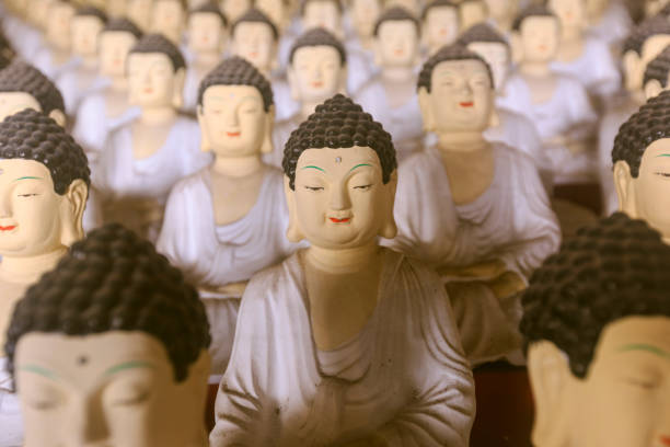 istock Budda faces and budda statues in meditation 1048401044