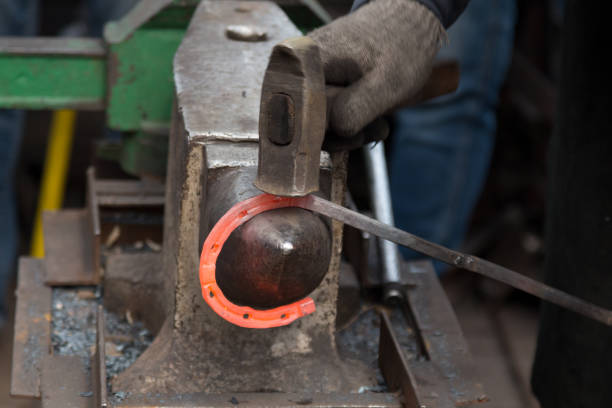 red hot horse shoe on anvil