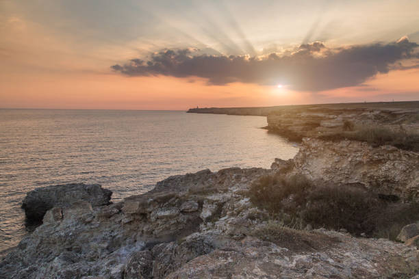 istock Sunset on the sea. Rocky stone coast. 1048402600