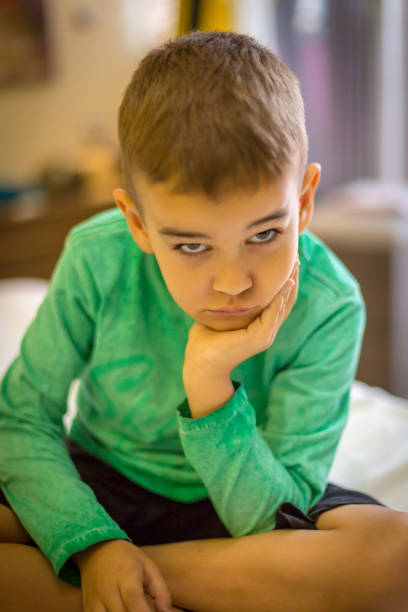 istock Little boy playing with toy blocks 1048409230