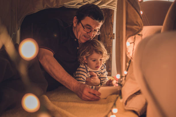 istock Enjoying in a tent with my grandfather 1048412382