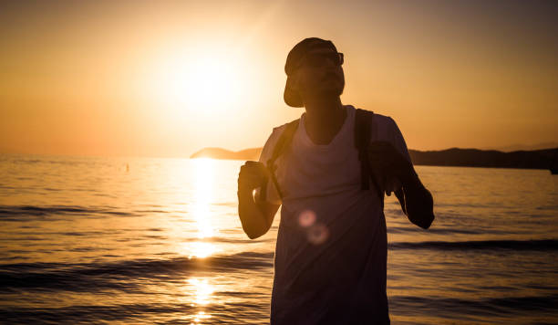 istock Male silhouette at sunset 1048414838