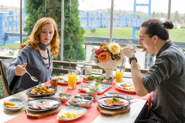 istock Young couple having breakfast in luxury restaurant 1048420206