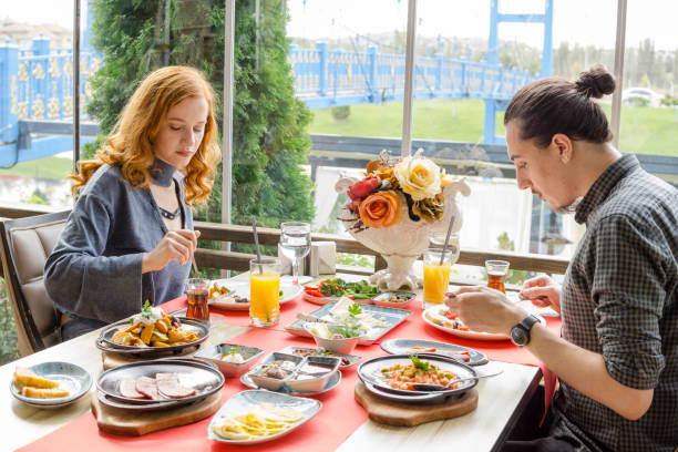 istock Young couple having breakfast in luxury restaurant 1048420212