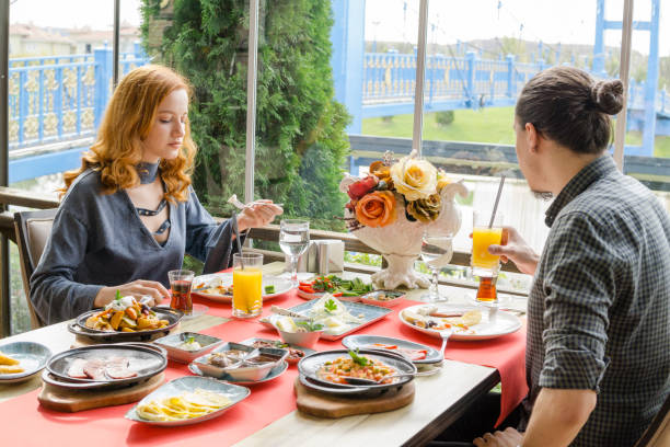 istock Young couple having breakfast in luxury restaurant 1048422266