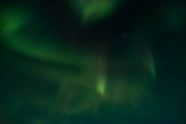 istock View at the northern lights in the night sky. 1048422348