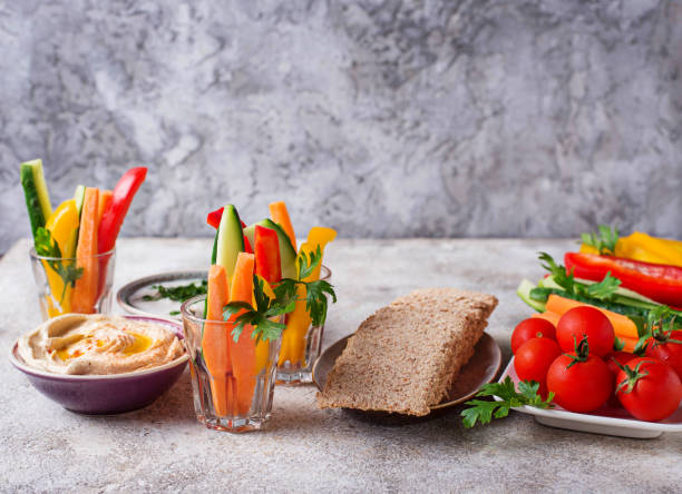 istock Snacks bar.  Vegetables sticks and hummus 1048432528