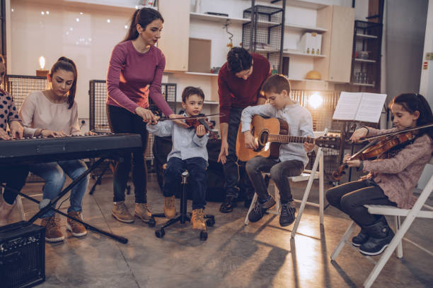 istock Group of kids playing instruments 1048432540