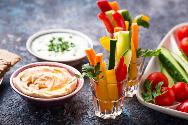 istock Healthy snacks. Vegetables and hummus 1048432570
