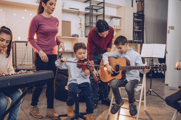 istock Group of kids in music school 1048432736