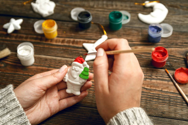 istock Woman create stylish christmas gifts 1048435556